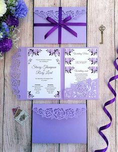 purple and white wedding stationery with ribbon, flowers and ribbons on the table next to it