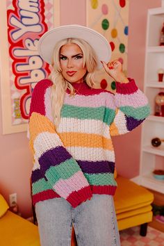 - Keep it cute this cozy season with this adorable sweater! - Unlined knit material with a purple, green, yellow, and cream hued striped pattern - A crew cut neckline - Long, loose sleeves with ribbed cuffs - A relaxed silhouette that ends in a ribbed hemline Multicolor Soft Knit Crew Neck Sweater, Trendy Rainbow Sweater For Fall, Multicolor Crew Neck Soft Knit Sweater, Cute Striped Long Sleeve Sweater, Cute Multicolor Winter Sweater, Long Sleeve Purple Color Block Sweater, Oversized Rainbow Sweater For Fall, Playful Soft Knit Sweater For Fall, Purple Color Block Sweater For Winter