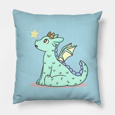 a blue pillow with a cartoon dragon sitting on it's back and stars in the background