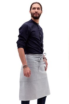 Modern and functional design with three large pockets, one small pocket, and a utility loop to hang items from. Great for servers, barbers, baristas, cooks, and makers of all kinds. 32”W x 25”L – 100% Cotton (80% upcycled) Bistro Apron, Artisan Decor, Denim Projects, Sustainable Textiles, Aprons For Men, Chef Apron, Half Apron, Apron Pockets, Upcycled Denim