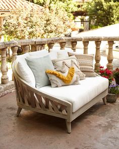 a white couch sitting on top of a patio