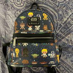 a star wars themed backpack with various characters on it