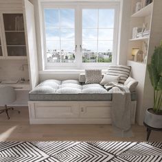 a living room with a couch, window and rugs on the floor in front of it