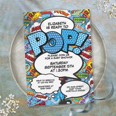 an image of a pop party flyer on a plate with white flowers in the background