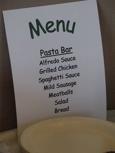 a menu for a restaurant on a plate with a fork and knife next to it