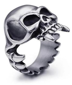 In the vampire species, the canines are fundamental to enable them to drive their fangs into the necks of their victims. with the skull ring vampire fangs, you're immune! Stainless Steel 316L : does not blacken, resistant to chlorine No form of discomfort on your skin Neat details Weight: 20gr STANDARD SHIPPING OFFERED ☠️ Refer to our MEASURING GUIDE if you're not sure what size to order.. ☠️👉Discover our collection Skull Rings Black And Red Rings, Satanic Star, Skull Vampire, Vampire Ring, Warrior Ring, Viking Skull, Austrian Empire, Serpent Ring, Rock Rings