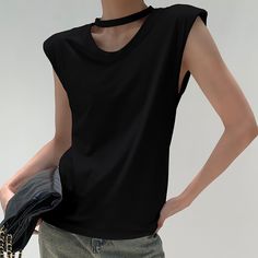 image_6 Black Tank Top Solid Color, Black Solid Color Tank Top, Trendy Sleeveless Solid Color Top, Chic Solid Color Tank Top, Solid Sleeveless T-shirt, Black Solid Color Tank Top For Spring, Casual Black Sleeveless Blouse, Edgy Crew Neck Tank Top, Trendy Black Sleeveless Tops