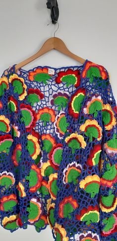 This colorful cardigan is a comfortable choice for any season. It is a ready-made product The cardigan is suitable for sizes S-M-L. Bohemian Crochet V-neck Cardigan, Bohemian V-neck Crochet Cardigan, Green Long Sleeve Crochet Top, Green Long Sleeve Crochet Top For Beach, Summer Crochet Long Sleeve Cardigan, Handmade Cotton Bohemian Sweater, Long Sleeve Crochet Cardigan For Summer, Handmade Bohemian Cotton Sweater, Multicolor Cotton V-neck Cardigan