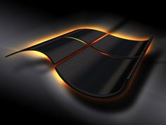 an image of a black and orange computer mouse on a dark surface with light coming from it