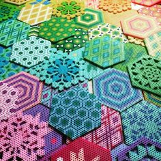 many different colored hexagons are arranged on top of each other in rows