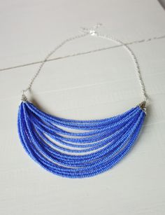 Statement layered necklace blue bib necklace dark powder blue multi stranded statement necklace for women Blue Beaded Chain Bib Necklace With Round Beads, Blue Round Beaded Chain Bib Necklace, Blue Multi-strand Spacer Beads, Blue Beaded Chain Bib Necklaces, Multi-strand Blue Spacer Beads, Blue Bib Necklace With Beaded Chain And Round Beads, Blue Multi-strand Beads For Jewelry Making, Multi-strand Blue Beads For Jewelry Making, Blue Multi-strand Beaded Chain