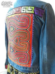 "Embellished denim jacket decorated with the textile art used by the women of the Guna tribe of Panama, called Mola. The Guna women use molas as the main element of their blouses.  This mola is trimmed with purple ric rac trim. Size L, see details below. Jacket dimensions: Chest - 42\" Hips - 42\" Sleeve length - 25\" Shoulder to hem - 22.5\" DRY CLEAN ONLY www.solomiadesigns.com" Clothing Upcycle, Patchwork Clothes, Embellished Denim Jacket, Boho Denim, Repurposed Clothing, Denim Outerwear, Embellished Denim, Upcycled Fashion, Ric Rac