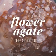 flowers against the nurturer logo on a round glass plate with white lettering that reads, flower agate