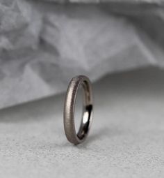 a wedding ring sitting on top of a table