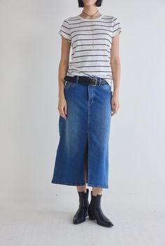 The 90's Denim Midi Skirt is a nostalgic revival of the iconic denim trends from the past, infused with a modern twist for a fresh and stylish edge. This skirt is crafted for those who appreciate the timeless charm of the '90s, making it a must-have piece for the fashion-forward individual. Midi length Split center hem Denim fabric Pockets Classic Cotton Denim Skirt For Spring, Classic Mid-rise Denim Skirt For Spring, Retro High Rise Denim Skirt For Spring, Classic Mid-rise Denim Skirt For Summer, Trendy Relaxed Fit Medium Wash Denim Skirt, Classic Medium Wash Denim Skirt For Spring, Classic High Rise Denim Skirt For Summer, Classic Dark Wash Denim Skirt For Spring, Classic Straight Leg Denim Skirt For Spring