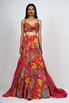 Red floral printed lehenga with attached cancan. Comes with embroidered padded bustier and dual tone dupatta.
Component: 3
Pattern: Print and Embroidery
Type Of Work: Floral print, Beads embroidery
Neckline: Sweetheart
Sleeve Type: Sleeveless
Fabric: Raw Silk,Organza
Color: Red
Other Details: 
Attached lining
Floral print
Embellished bustier
Occasion: Destination Wedding - Aza Fashions Festive Organza Sets With Digital Print, Red Printed Party Set, Red Printed Sets For Navratri, Bollywood Style Red Floral Print Set, Red Printed Wedding Sets, Red Georgette Sharara With Printed Motifs, Red Floral Print Sharara For Wedding, Red Floral Print Sets For Navratri, Red Floral Print Sets For Wedding