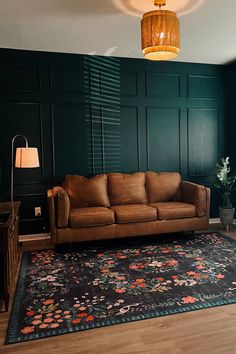 a living room filled with furniture and green walls