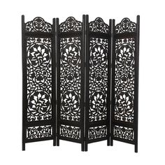 a black room divider with an intricate design