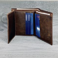 "TRIFOLD MENS WALLET, Personalized Wallet Gift, Minimalist wallet, Leather Wallet Holds Lots of Money GIFT BOX AVAILABLE --------------------------------HIGHLIGHTS-------------------------------------------------- * 3.5\" by 4.25\" (US, Canada & Australian currencies) * 9 cm by 11 cm (UK & Euro currencies) * Fits unfolded money - 2 bill packets * 8 card pockets, allowing you to carry 8+ cards. 2 ID pockets * Distressed Leather, gets better and better with age. * Minimalist design is a pe Trifold Wallets With Rfid Blocking For Gifts, Trifold Wallet With Card Slots As Gift, Trifold Wallet With Interior Card Slots As Gift, Trifold Wallet With Rfid Blocking As Gift, Gift Trifold Wallet With Interior Card Slots, Gold Trifold Wallet With Card Slots For Everyday Use, Gold Bifold Wallet For Daily Use, Gold Bifold Wallet For Everyday Use, Gold Bifold Wallets For Daily Use