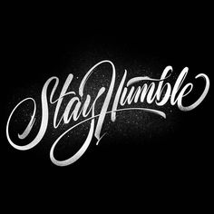 the word stay humble written in white ink on a black background