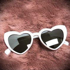 *1 Pair White* Please Check Our Other Listings For Other Colors These Are The Cutest Heart Sunglasses! Perfect For Topping Off Your #Ootd Or For A Pinup Or Vintage Photoshoot Prop. Now In Stock And Ready To Ship! Uv400 Protection Mirrored Finish Lenses Protective Pouch Included Paris Hilton Wore Very Similar Ones In Her Documentary [ Pinup Rockabilly Vintage Barbie ] Sunglasses White, Coquette Sunglasses, White Heart-shaped Sunglasses For Beach, White Heart-shaped Beach Sunglasses, Trendy White Sunglasses For Valentine's Day, White Heart-shaped Sunglasses For Valentine's Day, White Heart-shaped Sunglasses With Tinted Lenses, Heart-shaped White Sunglasses With Tinted Lenses, Septum Piercing Jewelry