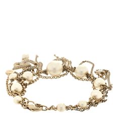 This is an authentic CHANEL Pearl Crystal CC Dangle Bracelet in Gold. This stylish bracelet is crafted of faux pearls of differing sizes with small light gold chain links and a crystal encrusted Chanel CC logo pendant. Chanel Pearl, Dangle Bracelet, Chanel Pearls, Stylish Bracelet, Pearl Crystal, Chain Links, Small Light, Cc Logo, Bracelet Gold