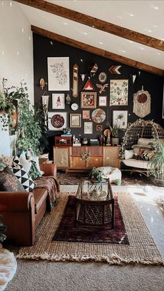 a living room filled with furniture and pictures on the wall