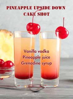 pineapple upside down cake shot in two glasses with cherries on the rims