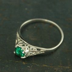 "Emerald Ring Cinderella Lab Grown Emerald May Birthstone Ring Silver Engagement Ring Promise Ring Filigree Emerald Ring Vintage Style Ring \"If you keep on believing, the dream that you wish will come true\" Cinderella sparks memories of glass slippers, fairy god mothers, and dancing until midnight. This is her ring...dainty, intricate and as stunning as can be! A detailed filigree setting securely holds a 5mm genuine Lab Grown Chatham Created Emerald. It is surrounded by intricate vining filig Emerald Ring With Intricate Design, Emerald Rings With Intricate Design For Anniversary, Heirloom Solitaire Emerald Ring, Oval Emerald Ring With Intricate Design, Elegant Filigree Ring As May Birthstone Gift, Elegant Filigree Ring With May Birthstone, Sterling Silver Filigree Engraved Promise Ring, Sterling Silver Emerald Ring For Promise, Elegant Filigree Ring For May Birthstone Gift