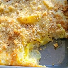 a casserole dish with cheese and bread crumbs