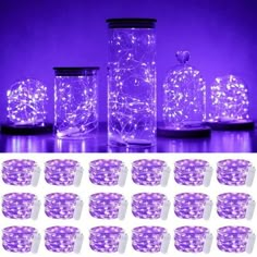 purple glass jars with lights in them are shown on the table and next to each other