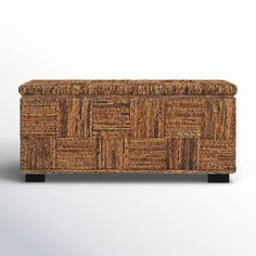 an upholstered wooden box with woven material on the top and bottom, sitting against a white background