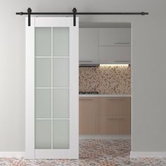 an open sliding door in a kitchen with tile flooring and white cabinetry on the walls