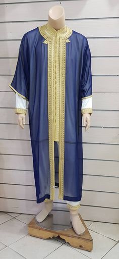 a male mannequin dressed in blue and gold