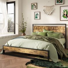 a bed sitting in a bedroom on top of a wooden floor next to a window