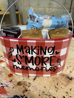 a basket that has some items in it on top of a wooden table with paint