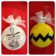 two christmas ornaments that have been decorated to look like cartoon characters