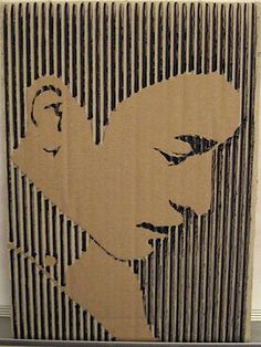 an image of a man's face on a cardboard box with lines in the background