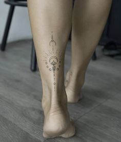 a woman's legs with tattoos on them