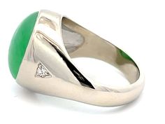 Item Specifications:Metal: 14k White Gold Style: Statement RingRing Size: 10.25 (resizing available for a fee)Total Weight: 15.5 GramsGemstone Specifications:Center Gemstone: Jadeite JadeShape: OvalColor: GreenCut: Cabochon Jade Carat Weight: ~18 CaratsJade Measurements: 17.2 mm x 13.5 mm x 8.5 mmDiamond Carat Weight: 0.10Diamond Clarity: VSDiamond Color: GCondition: Vintage, Excellent Modern Platinum Gemstone Rings, Formal Platinum Emerald Ring With Polished Finish, Formal Polished Platinum Emerald Ring, Fine Jewelry Platinum Emerald Ring With Polished Finish, Luxury Opal Ring With Accent Stones For Formal Occasions, Fine Jewelry Diamond Gemstones With Polished Finish, Fine Jewelry Polished Diamond Gemstones, Classic Multi-stone Green Gemstones, Green Platinum Rings With Accent Stones