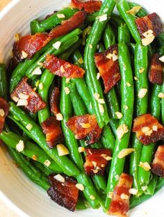 green beans with bacon and almonds in a white bowl