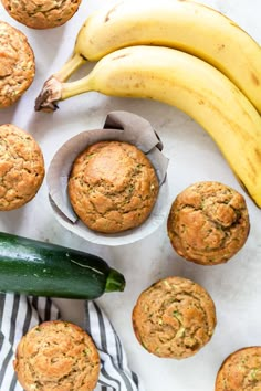 zucchini muffins and bananas on a table