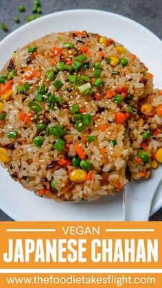 a plate with rice, peas and carrots on it next to the words vegan japanese chaan