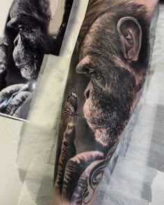 a man with a monkey tattoo on his arm