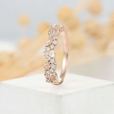 a diamond ring sitting on top of a white box