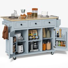 a blue kitchen island with lots of food on it's top and shelves in the middle