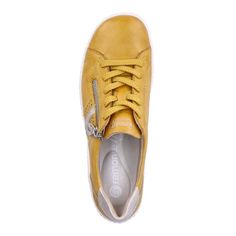 Rieker R1432-68 women's yellow lacing shoes are a pop of color for summer days. These women's mustard yellow sneakers have a smooth leather upper with perforated sides and contrasting white overlay panels. The cushioned lining and removable insole offers superb comfort and fits whilst the functional side zip allows easy foot entry. Color: Yellow Upper Material: Leather and Man-made Lining Material: Textile Fastening: Zip and Lace Removable Insoles: Yes Best For: Everyday Comfort Yellow Slip-on Sneakers For Spring, Mustard Low-top Sneakers For Spring, Mustard Sporty Sneakers For Spring, Sporty Mustard Sneakers For Spring, Comfortable Yellow Sneakers For Spring, Yellow Slip-on Sneakers With Rubber Sole, Yellow Lace-up Sneakers With Vulcanized Sole, Yellow Sneakers With Rubber Sole For Spring, Yellow Leather Sneakers With Vulcanized Sole