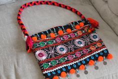 This Beautiful Afghani shoulder bag goes with western as well as traditional dresses. It is embellished with coins, sea shells and beads. Bohemian Embellished Bag For Vacation, Bohemian Embellished Bags For Vacation, Bohemian Beaded Tote Shoulder Bag, Bohemian Embellished Tote Shoulder Bag, Traditional Summer Shoulder Bag, Bohemian Embellished Shoulder Bag For Everyday, Bohemian Embellished Shoulder Bag For Festival, Bohemian Multicolor Embellished Shoulder Bag, Bohemian Embellished Travel Bags