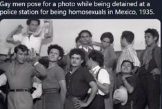 a group of people standing next to each other in front of a white wall with the caption gay men pose for a photo while being detained at a police station