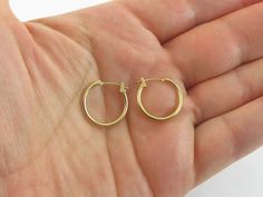 "Offering here is a pair of fabulous 14k yellow gold hoop earrings!! Purity : 14k yellow gold, Tested and stamped Measurements : 5/8\" in diameter or 17 mm wide by 1.5 mm thick. Closure: Hinged post and omega catch. Weight: 0.6 gram Complementary Gift Box These earrings are about the same size as a dime. Images may be enlarges to show details.Please pay attention to the photos and read description before the purchase. I ask you earnestly to make sure about measurements such as size , thickness, 14k Gold Round Huggie Earrings, 14k Stamped Yellow Gold Hoop Earrings, 14k Stamped Yellow Gold Round Hoop Earrings, Yellow Gold 14k Huggie Hoop Earrings, Stamped 14k Yellow Gold Hoop Earrings, Stamped 14k Yellow Gold Round Hoop Earrings, Yellow Gold Hoop Earrings With Lever Back, Engraved Locket, Gold Heart Locket